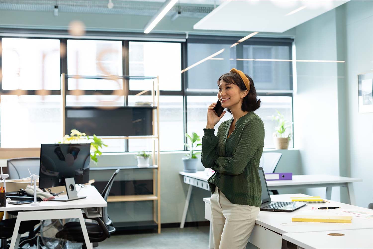 woman-in-office-talking-on-phone