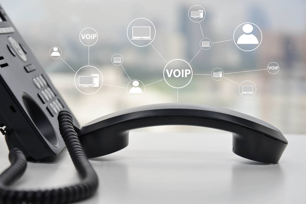 phone-on-desk-voip-icons-floating-on-top